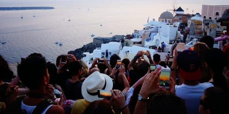 People fighting to get sunset picture in Santorini
