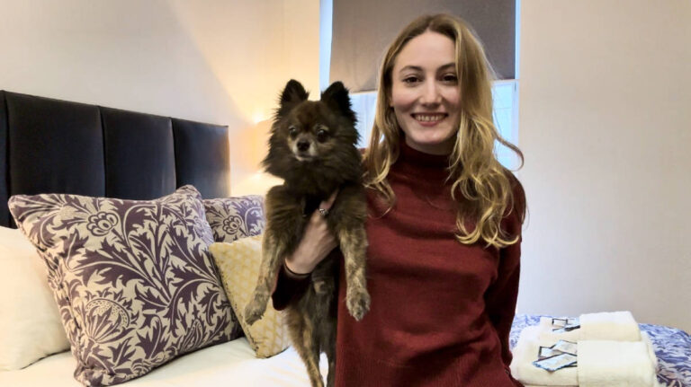 The author Sky and her dog inside the Royal Mile Romance Studio