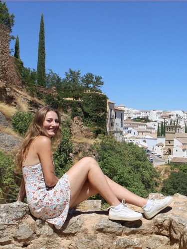 Sky Ariella smiling for a photo in Ronda, Spain