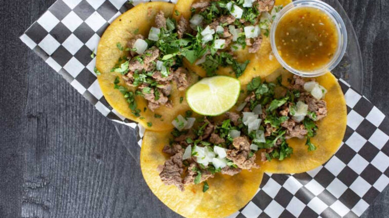 View of tacos with dip on a plate at Hunger Street Tacos