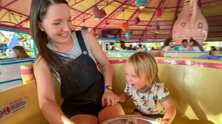 The Author, Katie Neufeld and son on the Teacups at Magic Kingdom