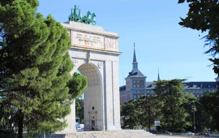 The Arco de la Victoria under the clear blue sky in Madrid