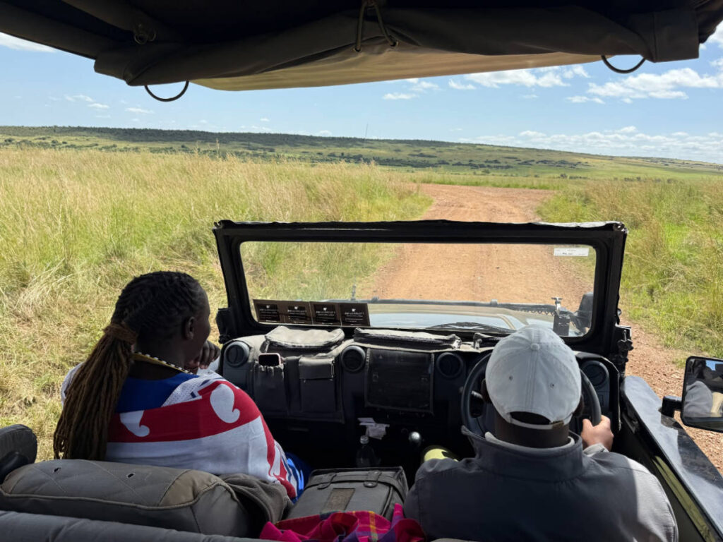 The guide and the spotter sitting on the front seat of the vehicle