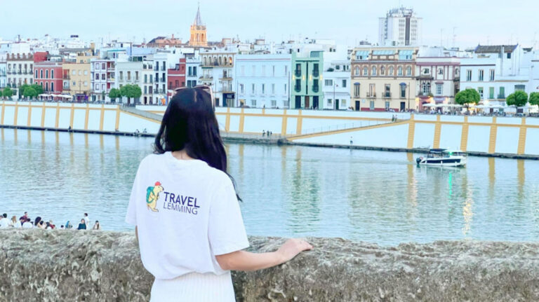 Travel Lemming writer Clara Kesseler looking out over the river in Sevilla