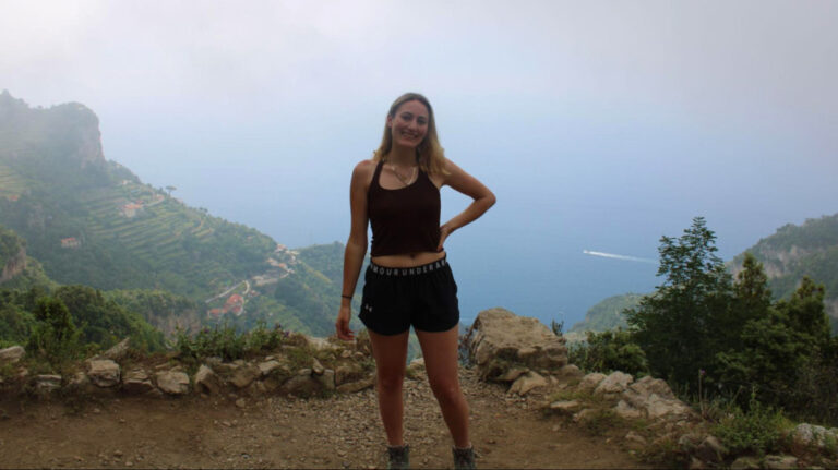Travel Lemming Writer Sky Ariella posing for a photo along the Path of the Gods