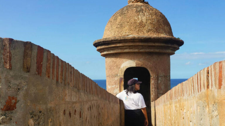 The author Vanessa Ramos, standing at the tower in Castillo San Felipe del Morro