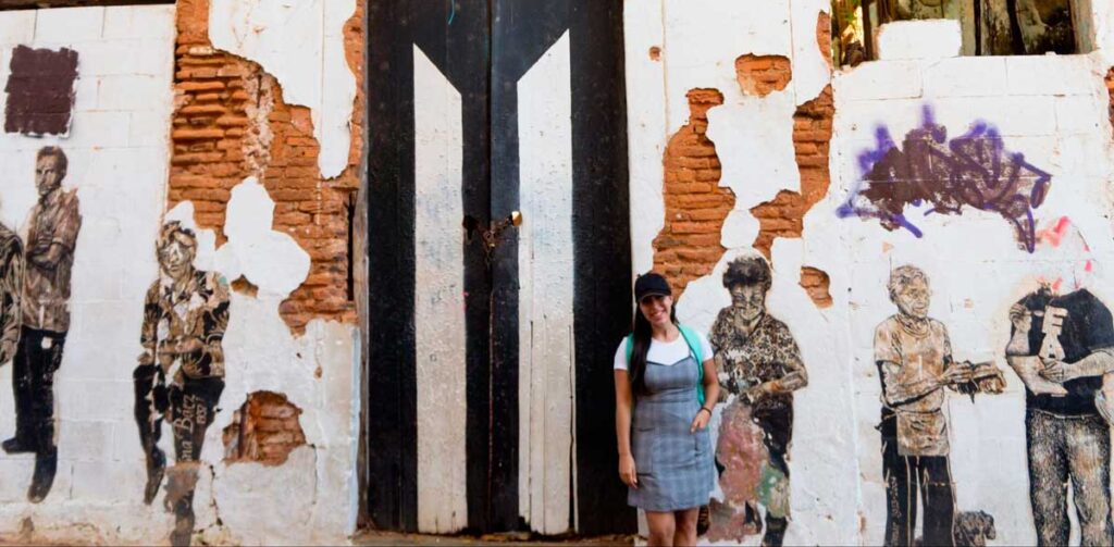 The author in front of the building ruins in San Juan