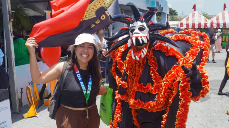 The author Vanessa Ramos, posing for a photo on the parade at the festival
