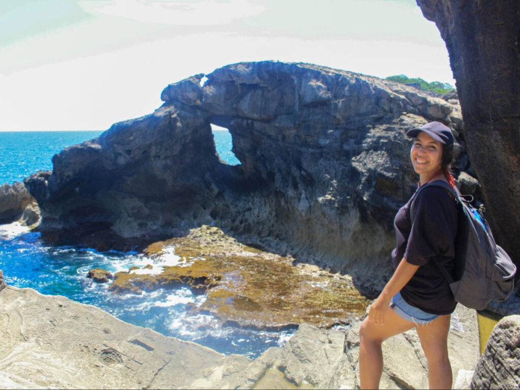 The author, Vanessa Ramos smiling for a photo at the Cueva del Indio