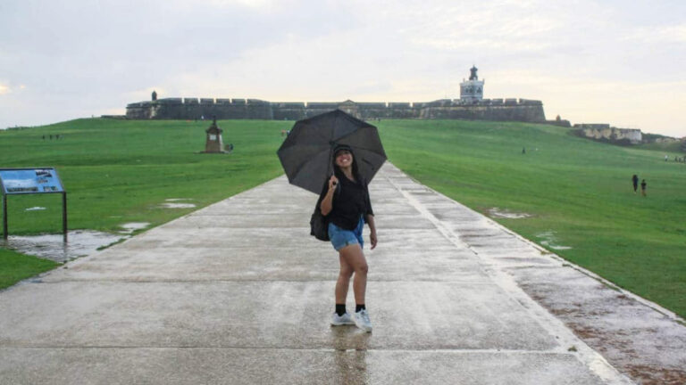 The author, Vanessa Ramos with an umbrella in Castillo San Felipe del Morro