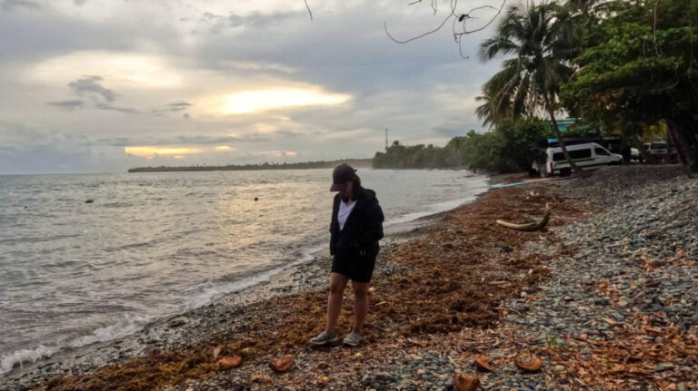 The author Vanessa Ramos walking along the Beach