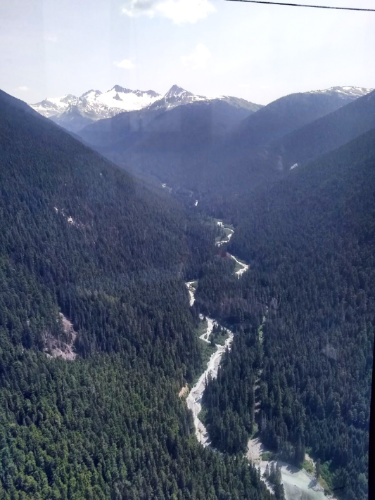 Overlooking view of the river between the mountains seen from the gondola ride