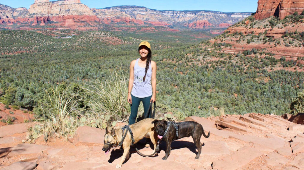 The author Abigail Bliss and her dogs, posing for a photo at the Red Canyon